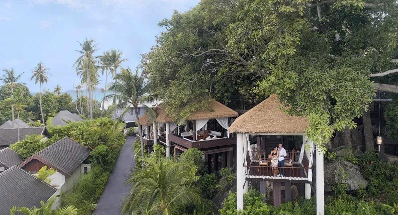 Raised timber pavilions among the trees at Anantara Lawana