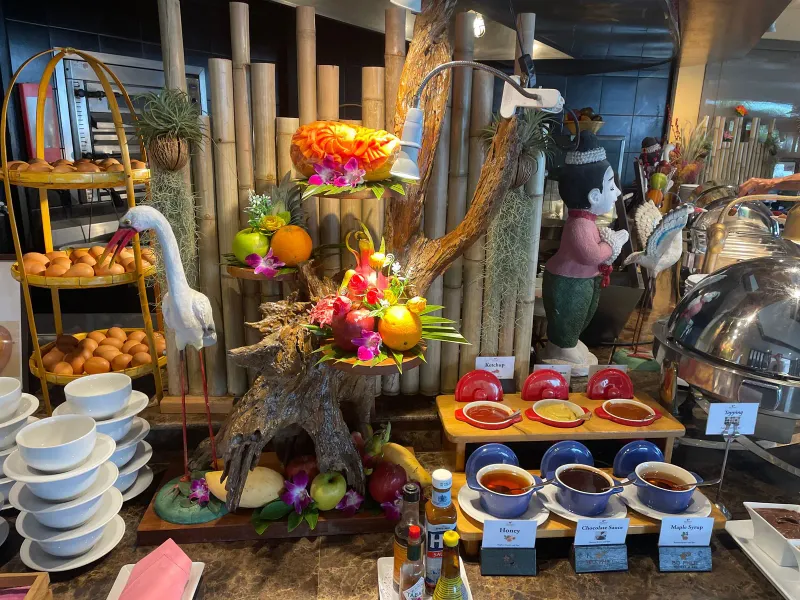 Buffet display at Bo Phut Resort and Spa with tiered fruit stands, bread baskets and preserves in small pots
