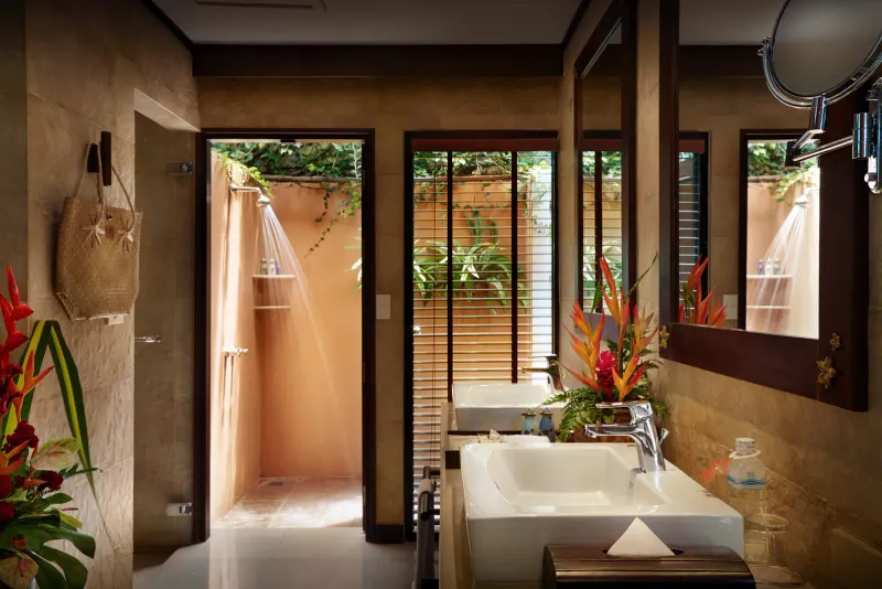 Villa bathroom at Bo Phut Resort and Spa with twin basins and an open-air garden shower