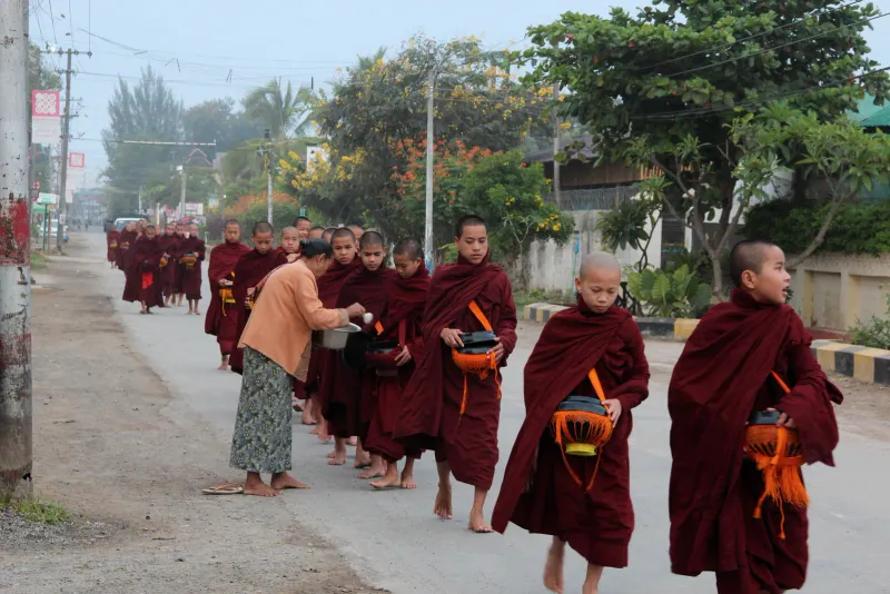 Monks walking the morning alms round
