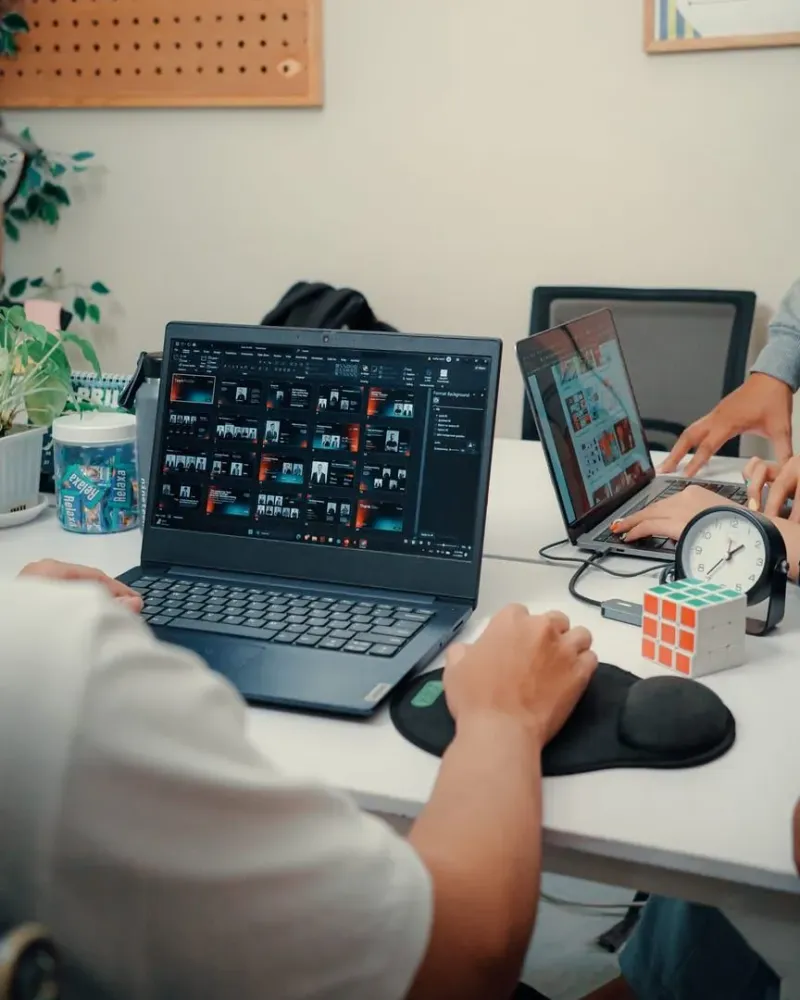 Laptop and coffee cup on a café table, a typical laptop-friendly workspace setup in Koh Samui