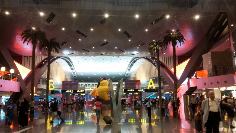 Passengers inside the large terminal of Hamad International Airport in Doha, Qatar