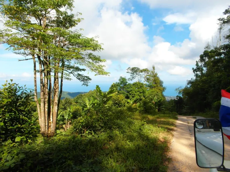 Coastline and jungle canopy seen from Koh Samui's interior hills near the Jungle Route 360 viewpoint