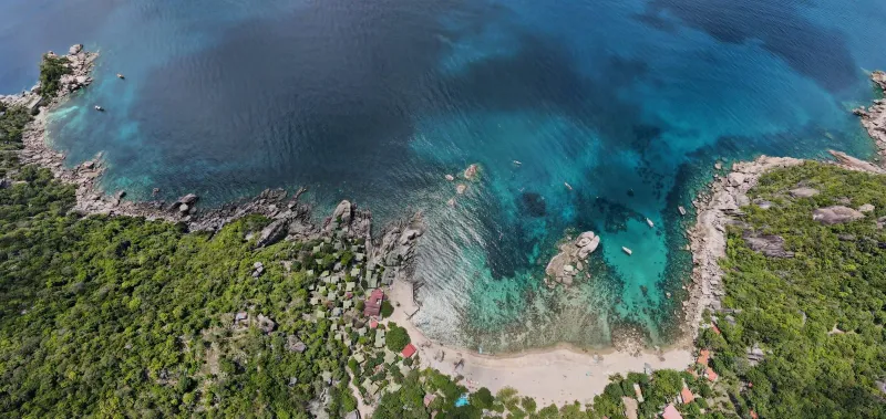 Clear turquoise water over a shallow reef near Koh Tao, viewed from above