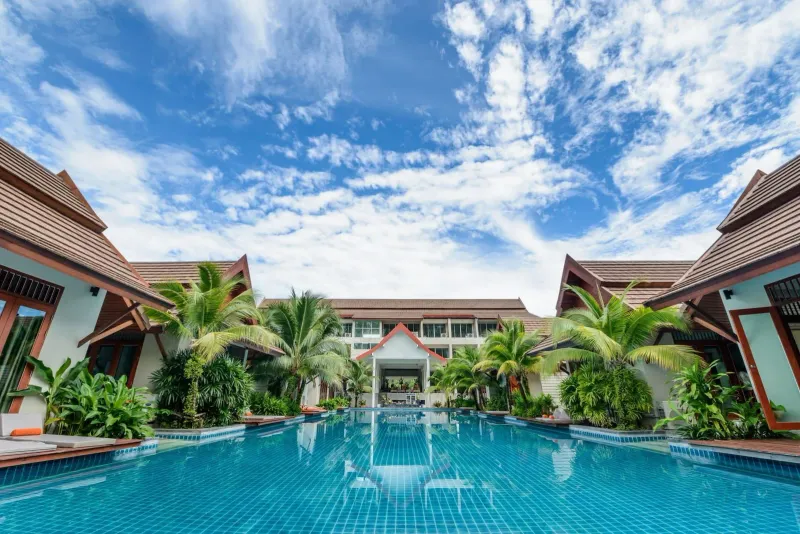 Spacious swimming pool surrounded by five-star villas on Koh Samui