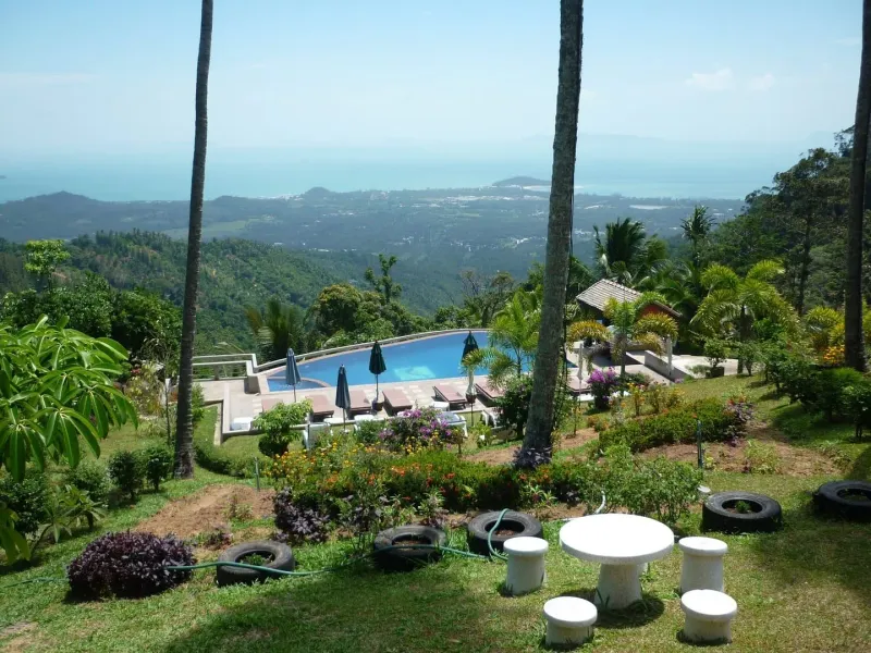 Elevated hillside view over Koh Samui's coastline and resorts, showing the island as travelers plan their booking timeline