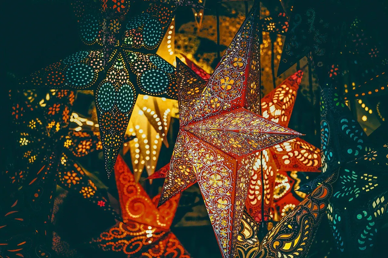 Star-shaped paper lanterns glowing in the dark