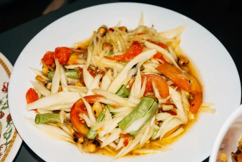 A plate of som tam, green papaya salad