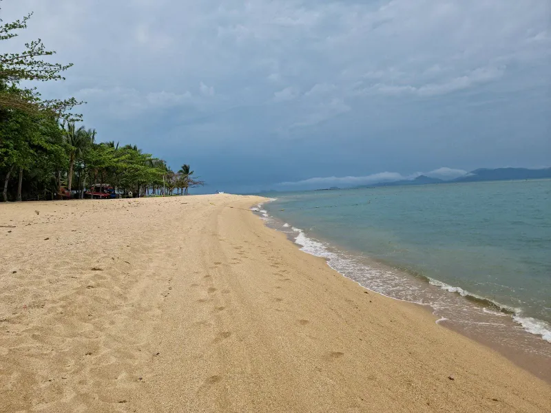 Empty stretch of sand under a cloudy sky on Koh Samui's north coast