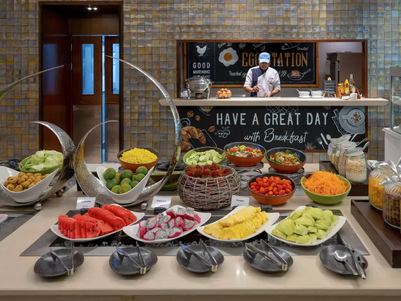 Fruit display at the OZO Chaweng Samui breakfast buffet with a chef at the live station