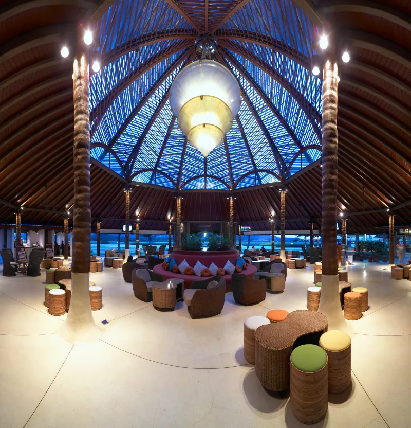 Timber-roofed open-air terminal lounge at Koh Samui Airport with tropical decor
