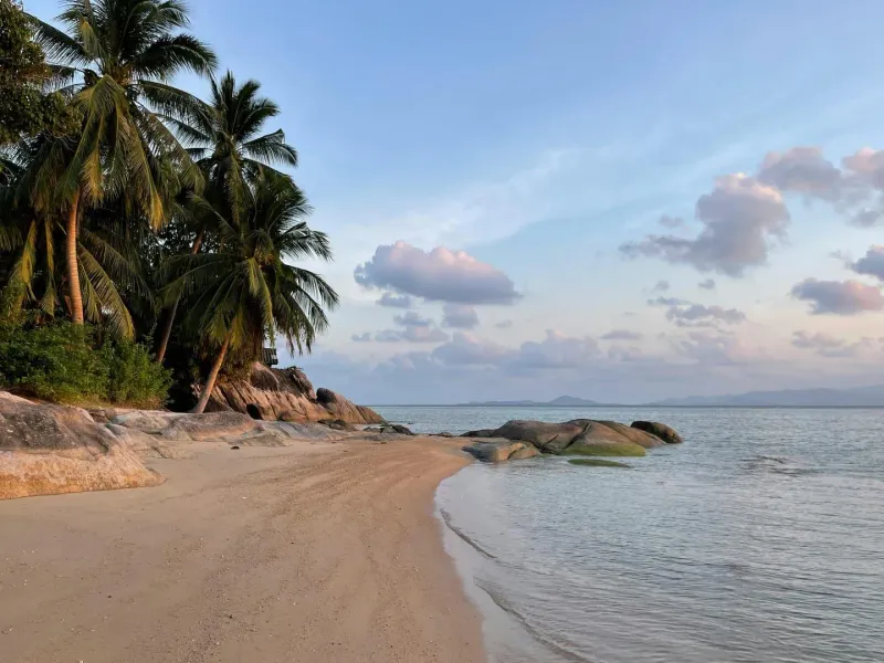 Calm shoreline at Bang Rak beach on Koh Samui's north coast, part of the flat Bophut-to-Bang Rak running stretch