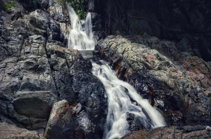 Water cascading over rocks at a jungle waterfall on Koh Samui