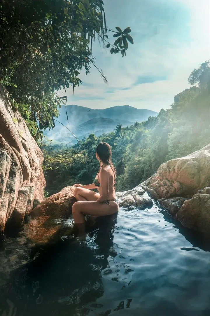 A natural jungle pool fed by a waterfall stream on Koh Samui