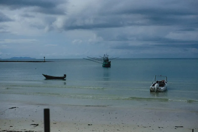 Fishing boats moored off Nathon beach, Koh Samui's southwest-monsoon kitesurfing season spot
