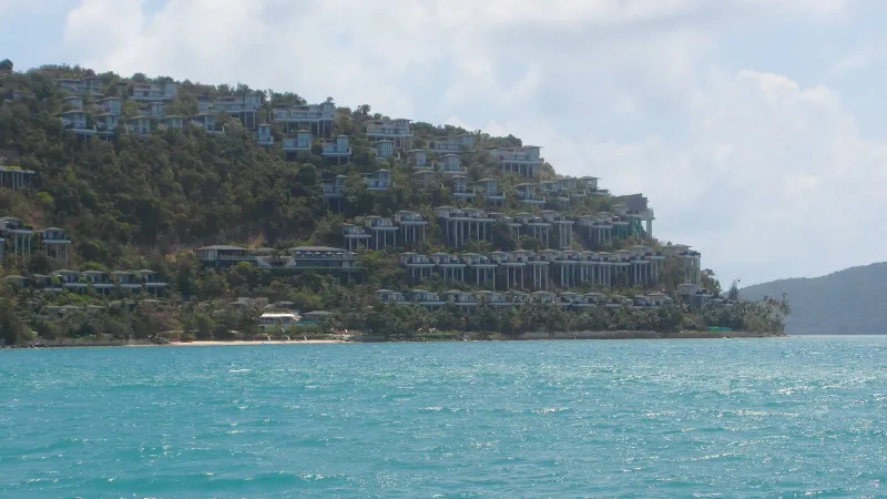 A terraced hillside resort above the sea near Taling Ngam, on the same clifftop stretch as Air Bar and Conrad Koh Samui