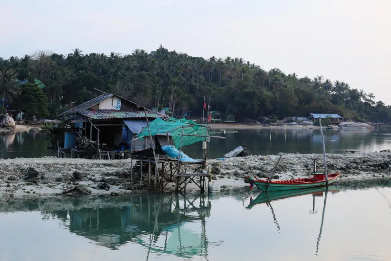 Colorful fishing boats moored close to shore at Thong Krut