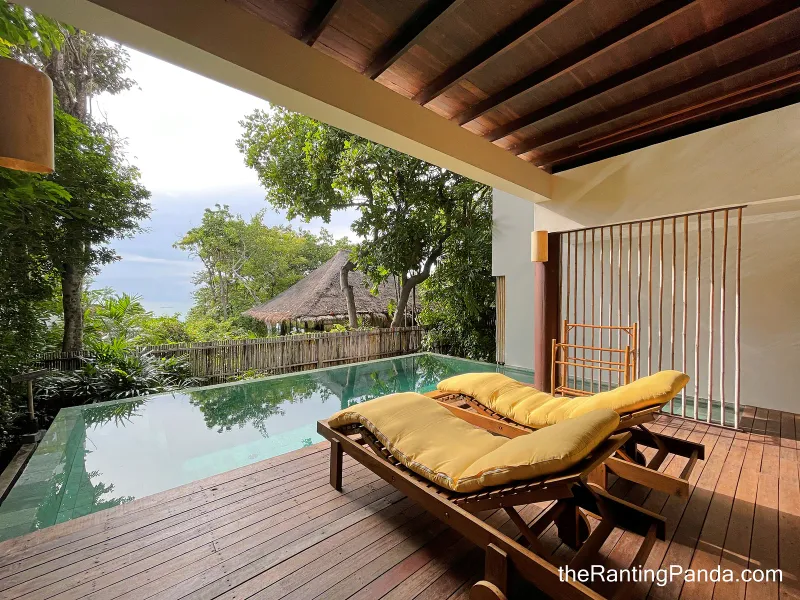 Villa terrace at Six Senses Samui with a private plunge pool, sun loungers and a thatched pavilion