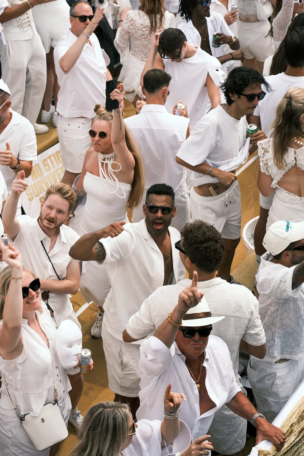 Guests dressed all in white at a party